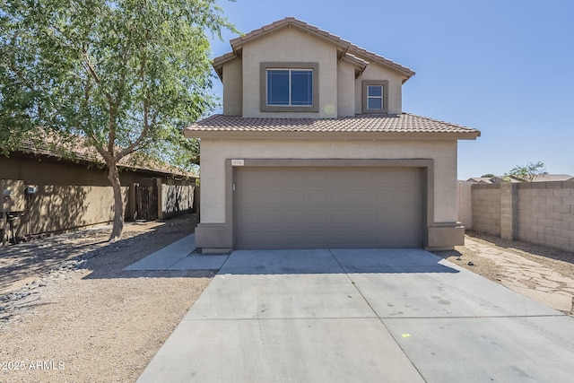 6731 W Northview Ave, Glendale, AZ 85303 - mediterranean / spanish-style house with a tile roof, concrete driveway, fence, an attached garage, and stucco siding