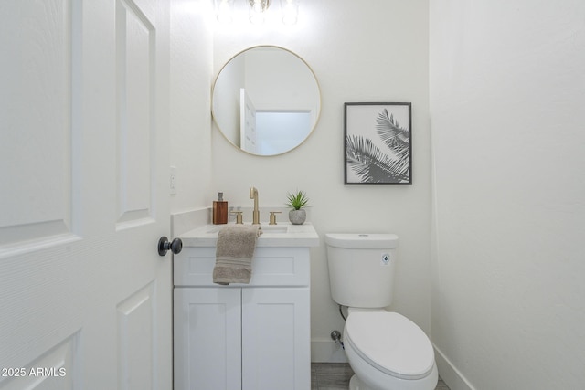 6731 W Northview Ave, Glendale, AZ 85303 - half bathroom featuring toilet, vanity, and baseboards