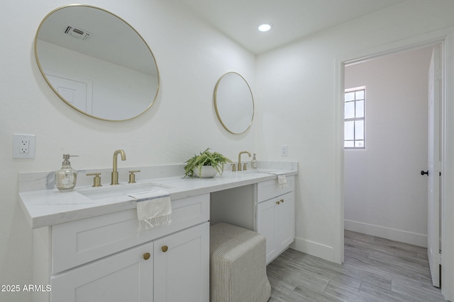 6731 W Northview Ave, Glendale, AZ 85303 - full bath featuring double vanity, visible vents, baseboards, and a sink
