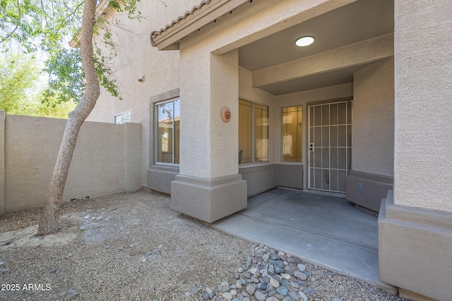 6731 W Northview Ave, Glendale, AZ 85303 - entrance to property featuring stucco siding, fence, and a patio area