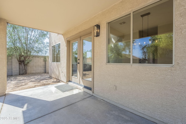 6731 W Northview Ave, Glendale, AZ 85303 - view of patio featuring french doors, visible vents, and fence