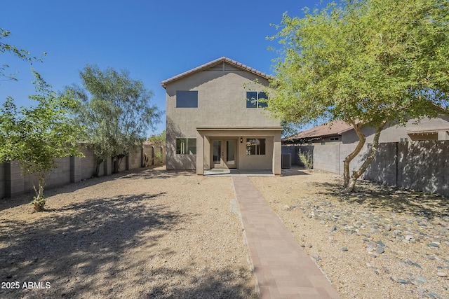 6731 W Northview Ave, Glendale, AZ 85303 - view of front of house featuring french doors, a tiled roof, a fenced backyard, and stucco siding