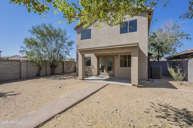 6731 W Northview Ave, Glendale, AZ 85303 - back of house featuring a fenced backyard, central AC, stucco siding, a patio area, and french doors