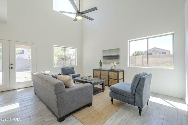 6731 W Northview Ave, Glendale, AZ 85303 - living room featuring wood finished floors, a towering ceiling, ceiling fan, and french doors