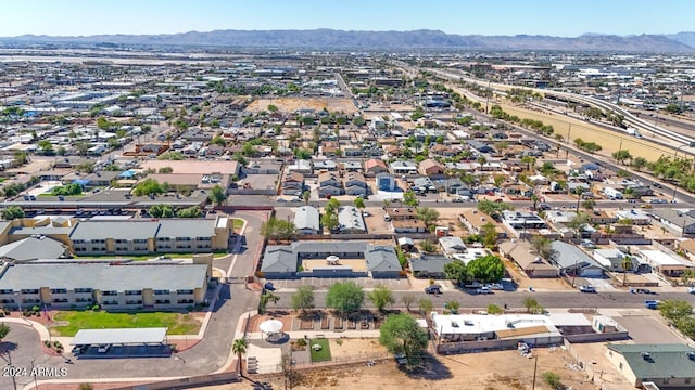 birds eye view of property with a mountain view