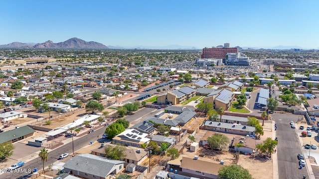 birds eye view of property featuring a mountain view