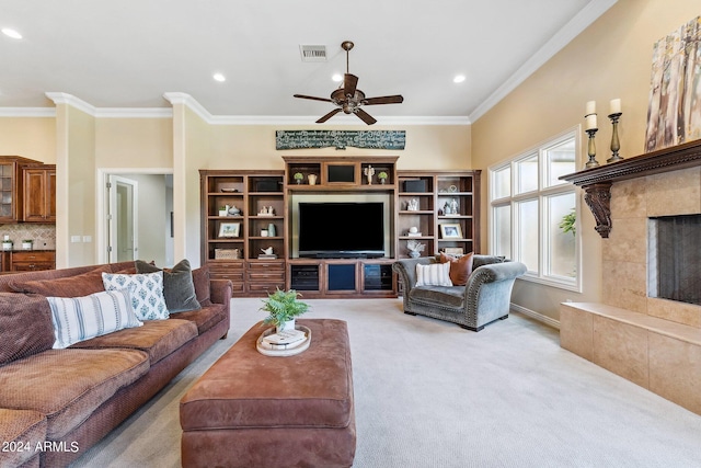 living room with light colored carpet, ceiling fan, and ornamental molding