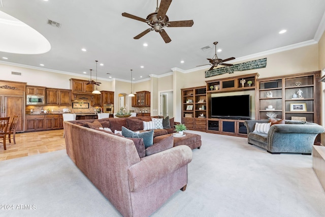 carpeted living room featuring ceiling fan and crown molding