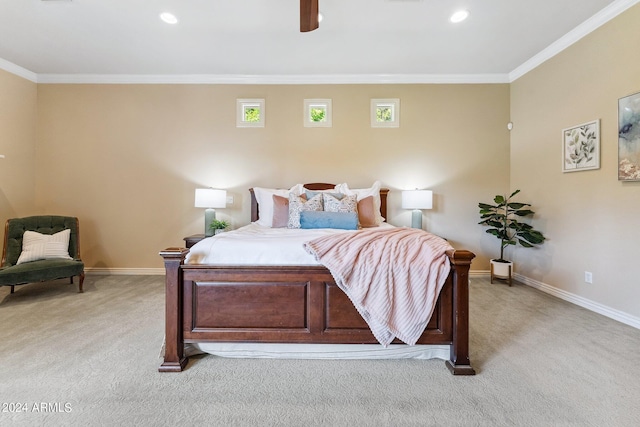 carpeted bedroom featuring ceiling fan and crown molding