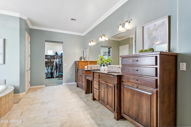 bathroom with vanity, tiled bath, and crown molding