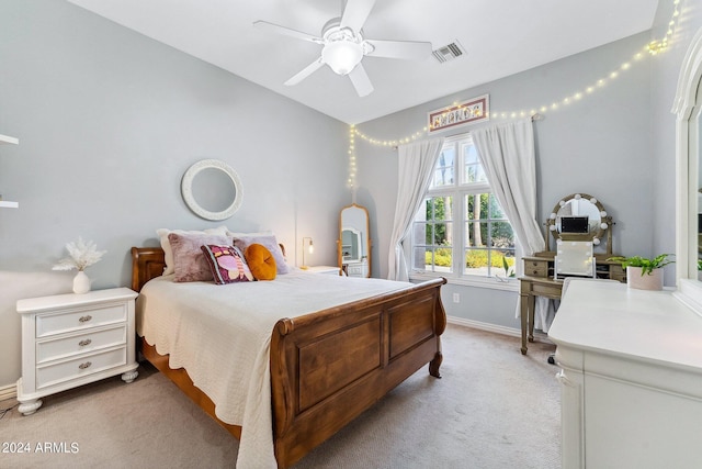 bedroom with light carpet and ceiling fan