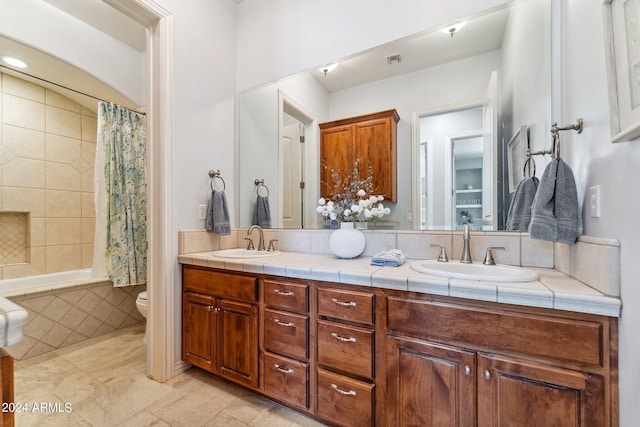 full bathroom with vanity, shower / bath combination with curtain, and toilet