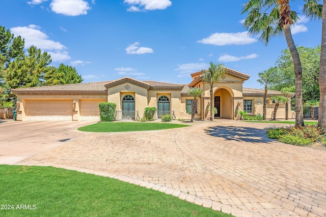 mediterranean / spanish-style house featuring a garage