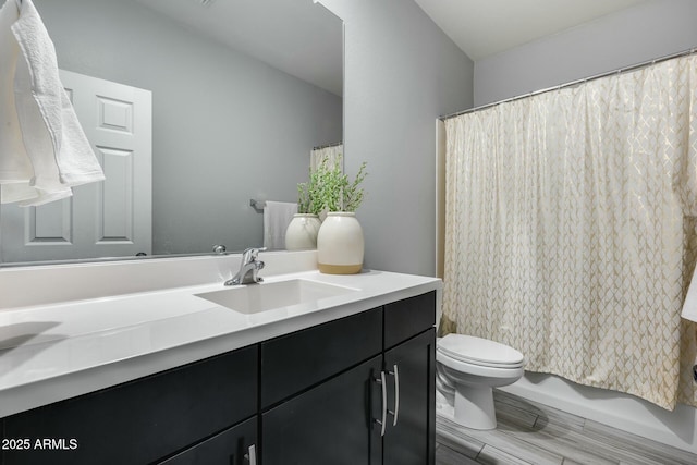 full bathroom with toilet, vanity, and shower / bath combination with curtain