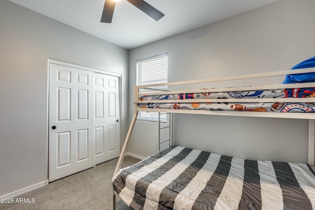 bedroom featuring a closet, ceiling fan, and carpet