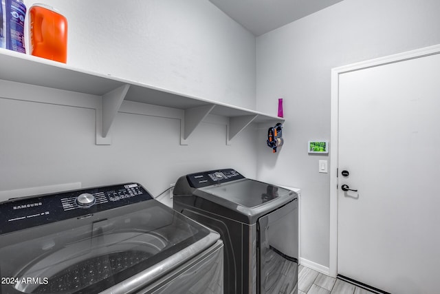 washroom with washer and dryer