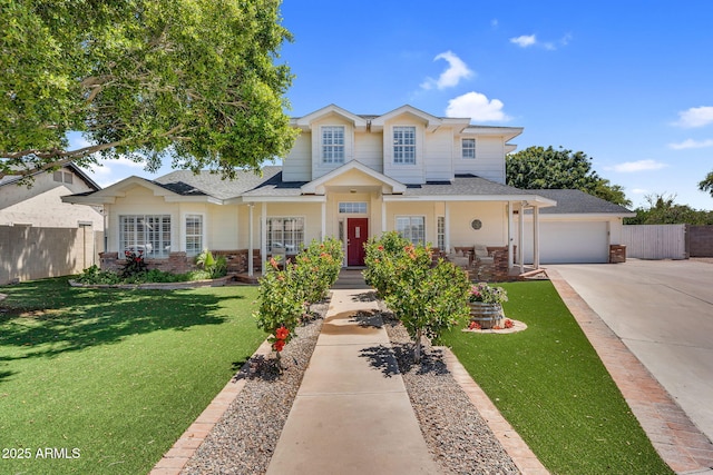 traditional-style home featuring fence, driveway, brick siding, and a garage