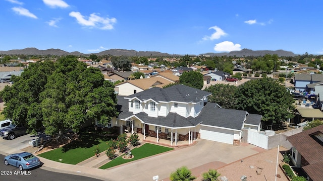 drone / aerial view with a residential view and a mountain view