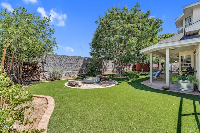 view of yard with a fenced backyard and a patio area