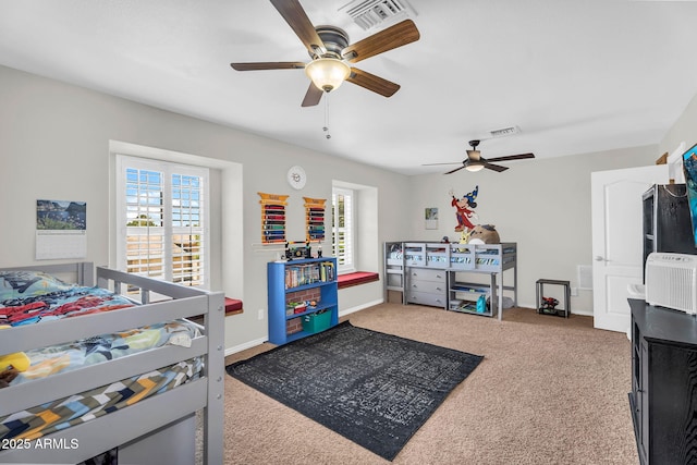 bedroom featuring carpet flooring, ceiling fan, visible vents, and baseboards