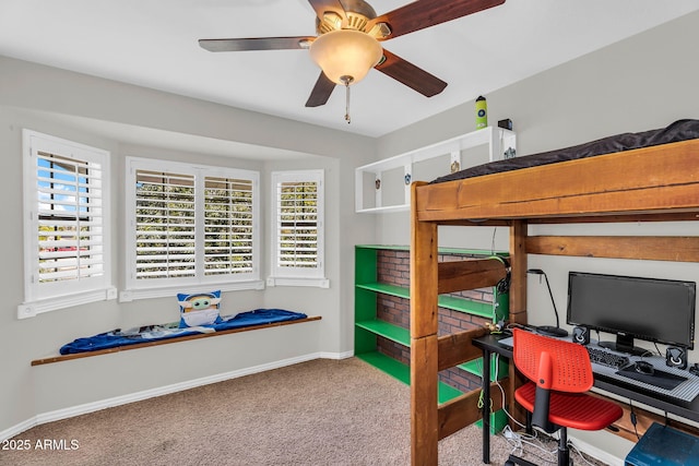 bedroom featuring carpet floors, multiple windows, and baseboards