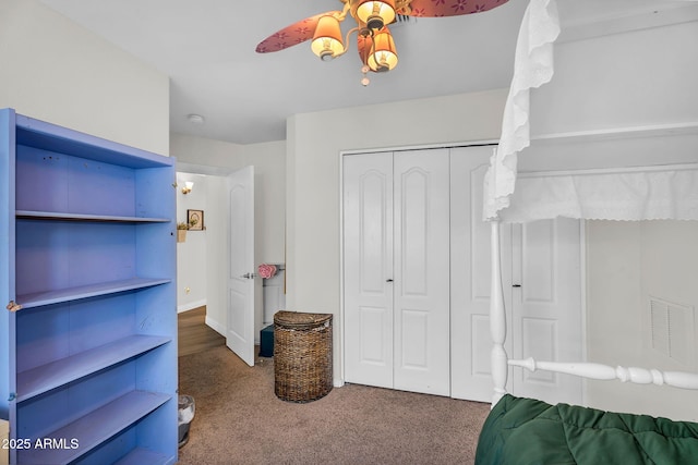 bedroom featuring a closet, ceiling fan, carpet flooring, and visible vents