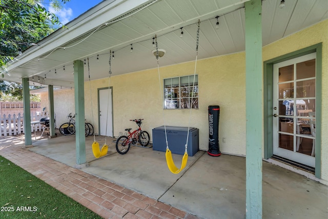 view of patio featuring fence