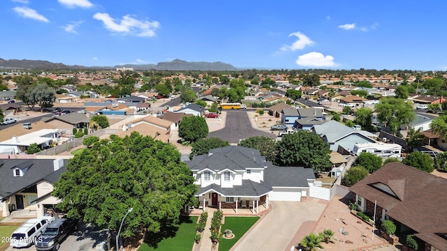 drone / aerial view with a residential view and a mountain view