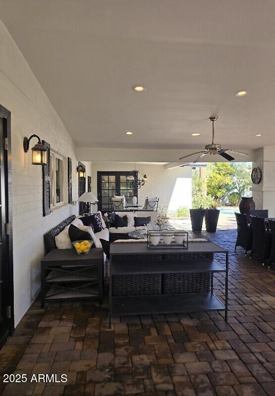 view of patio / terrace featuring ceiling fan, outdoor dining area, and an outdoor living space