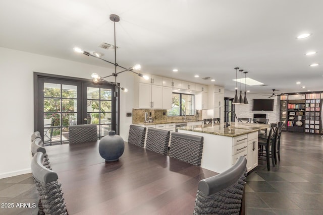 dining space with french doors, recessed lighting, visible vents, a ceiling fan, and baseboards