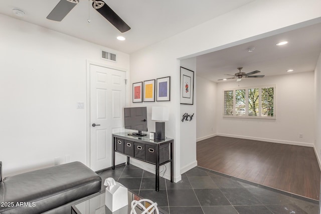 interior space featuring a ceiling fan, recessed lighting, visible vents, and baseboards