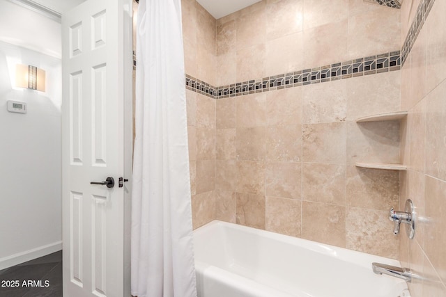 full bath with baseboards, tile patterned flooring, and shower / tub combo with curtain