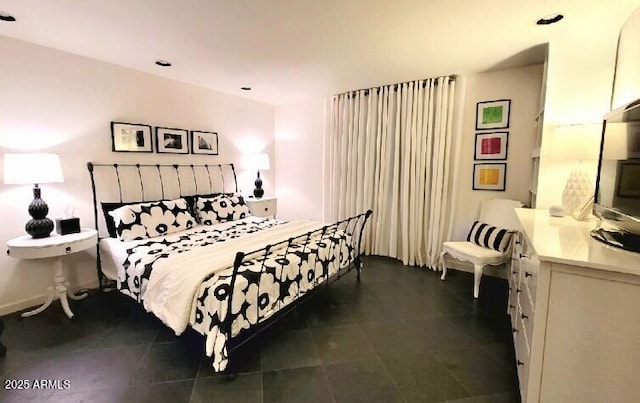 bedroom featuring dark tile patterned flooring