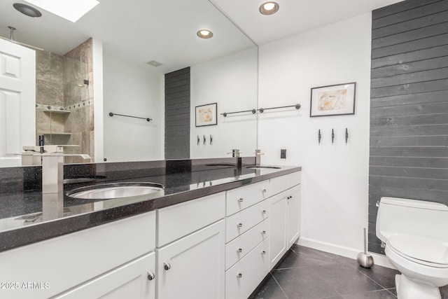 full bath with recessed lighting, a sink, toilet, and walk in shower