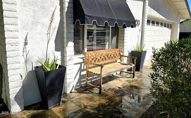 view of patio featuring an attached garage