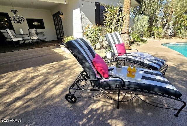 view of patio / terrace with an outdoor pool