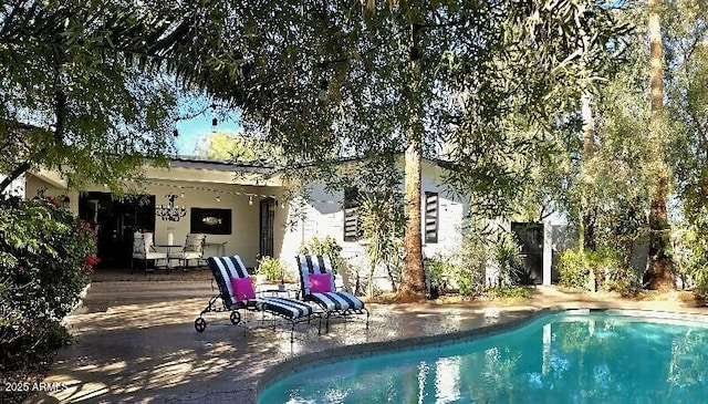 pool featuring a patio area