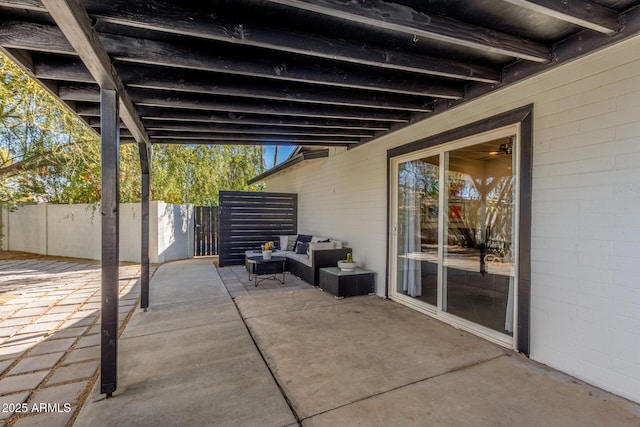 view of patio / terrace featuring fence