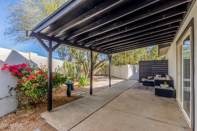 view of patio featuring outdoor lounge area and a fenced backyard