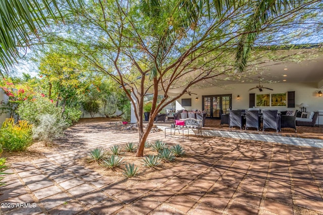 view of patio with a ceiling fan, french doors, and outdoor lounge area