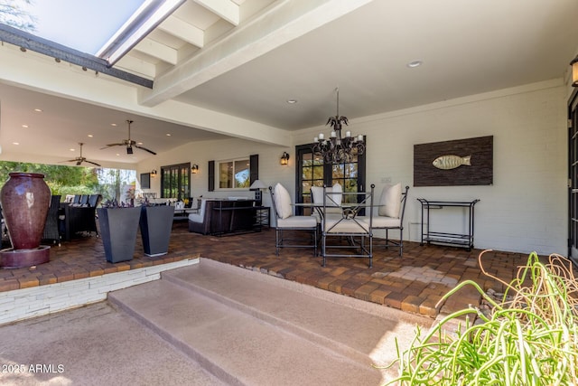 view of patio with ceiling fan, outdoor dining area, and an outdoor hangout area