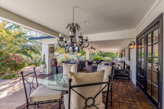 view of patio / terrace with an outdoor hangout area, french doors, outdoor dining space, and a ceiling fan