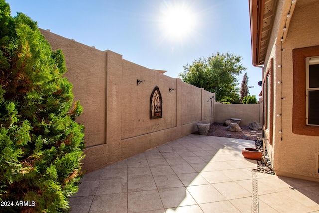 view of property exterior with a patio