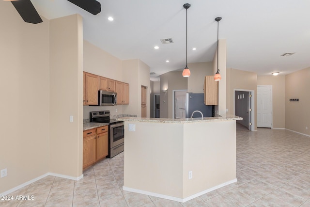 kitchen with pendant lighting, stainless steel appliances, light stone counters, and light tile patterned flooring