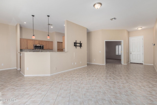 unfurnished living room featuring light tile patterned floors