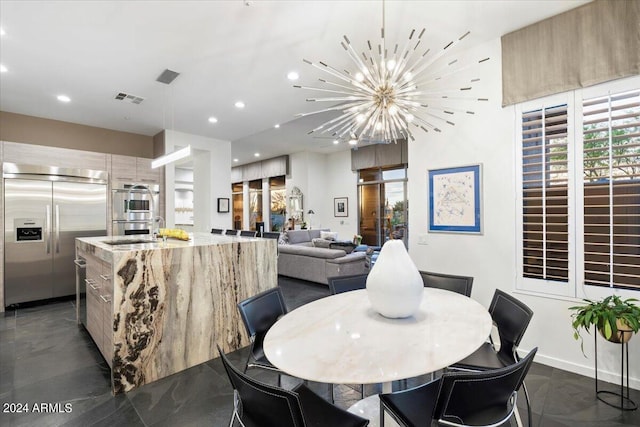 dining space featuring an inviting chandelier