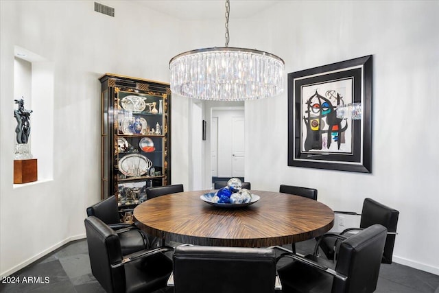 dining space with a chandelier