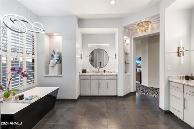 bathroom with vanity and a bath