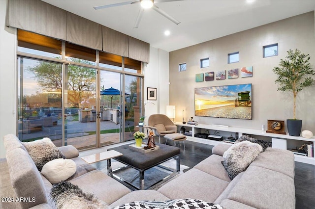 living room featuring concrete flooring and ceiling fan