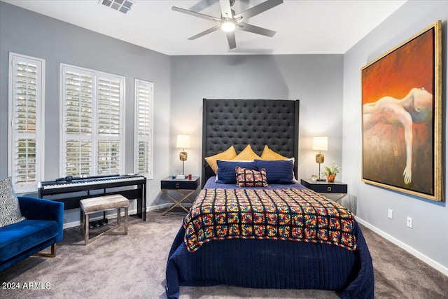 bedroom with ceiling fan and carpet floors